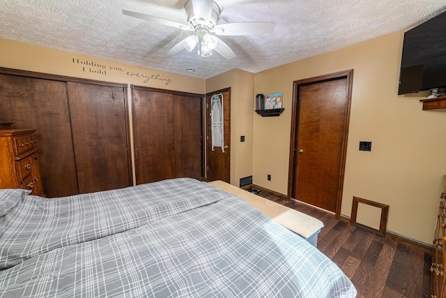 bedroom with a textured ceiling, ceiling fan, and dark hardwood / wood-style flooring