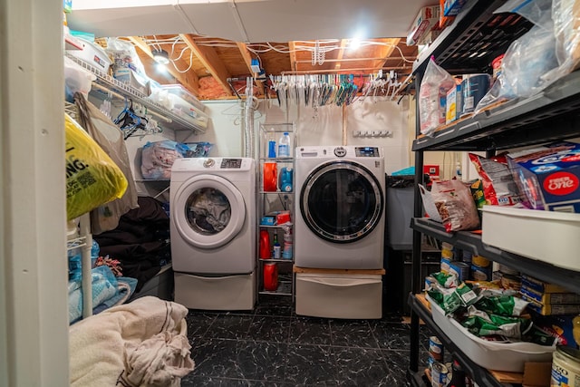 clothes washing area featuring washer and dryer