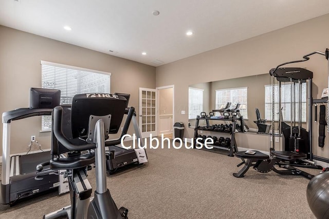 exercise room with carpet flooring