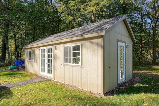 view of outbuilding featuring a yard