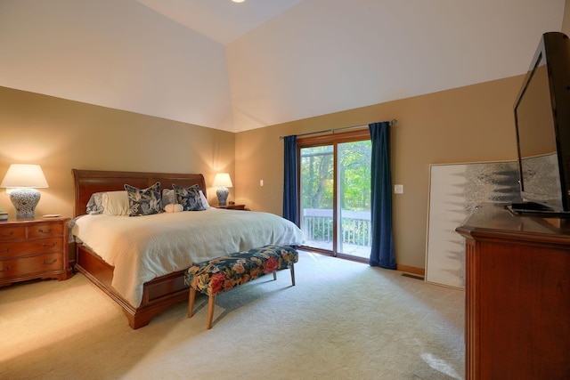 carpeted bedroom with access to exterior and high vaulted ceiling