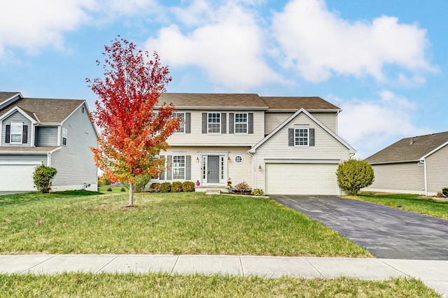 view of front of home featuring a front lawn and a garage