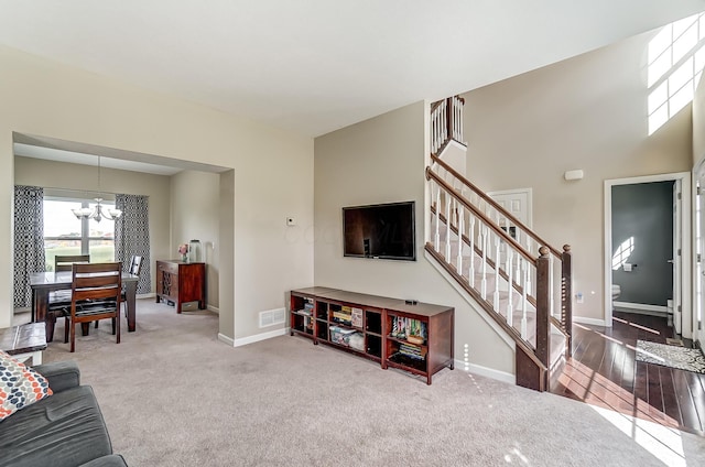 living room featuring a chandelier and hardwood / wood-style flooring