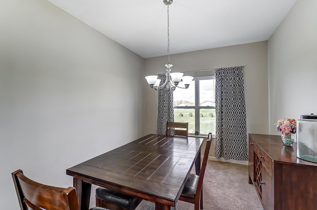 carpeted dining room with an inviting chandelier