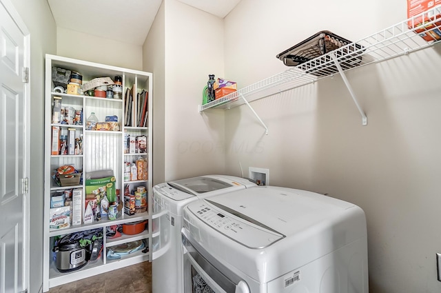 laundry room with washing machine and clothes dryer