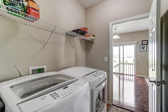 washroom featuring wood-type flooring and separate washer and dryer