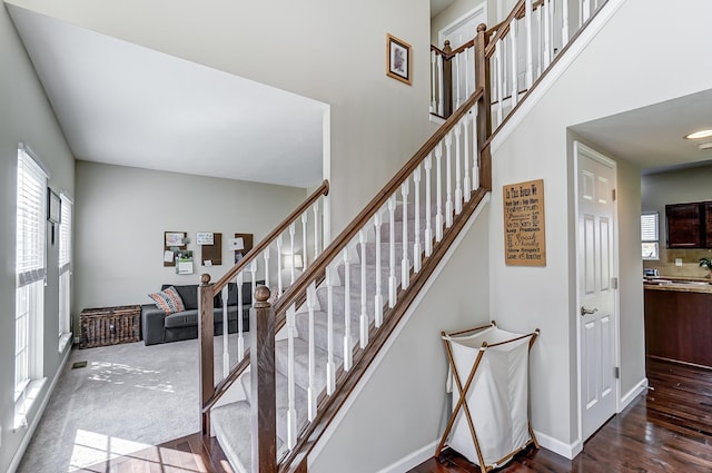 stairway featuring wood-type flooring