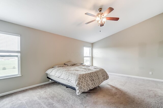 bedroom featuring carpet floors, ceiling fan, and lofted ceiling