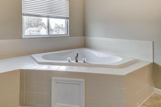 bathroom with tiled tub