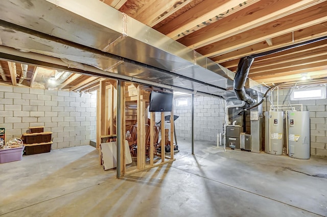 basement with electric water heater and water heater