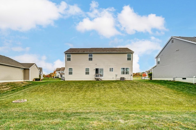 back of house featuring a lawn