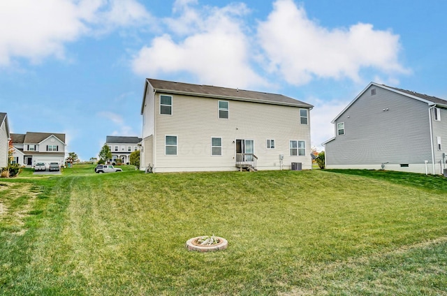 rear view of house with a lawn