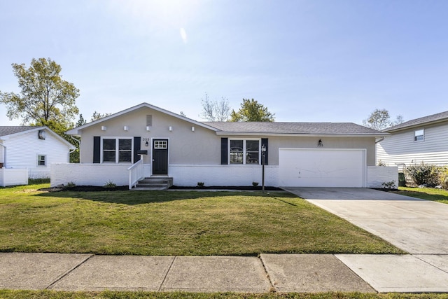 ranch-style home featuring a front yard and a garage