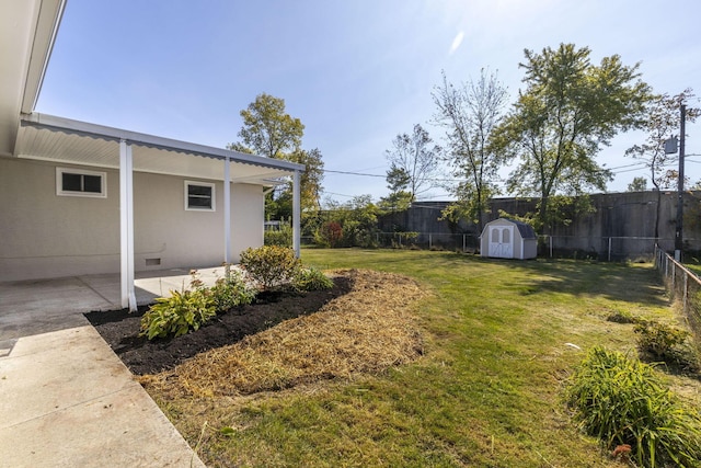 view of yard with a patio and a shed