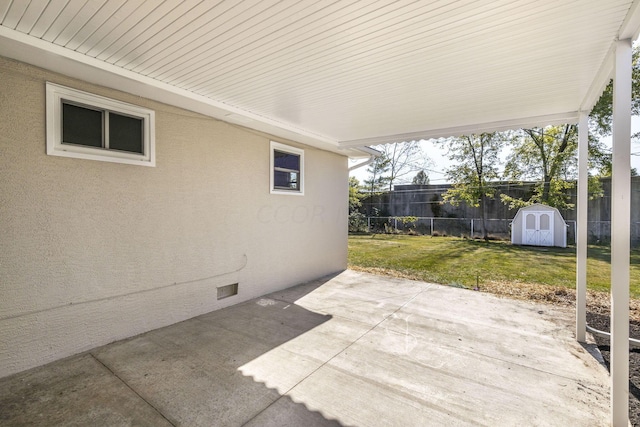 view of patio / terrace with a shed