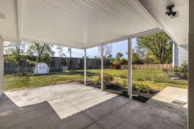 view of patio / terrace featuring a storage shed