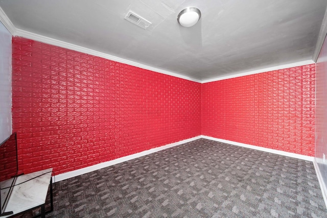 1109 Fairwood Ave, Columbus, OH 43206 - spare room with ornamental molding and dark colored carpet