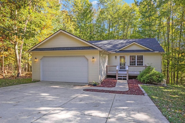 single story home featuring a deck and a garage