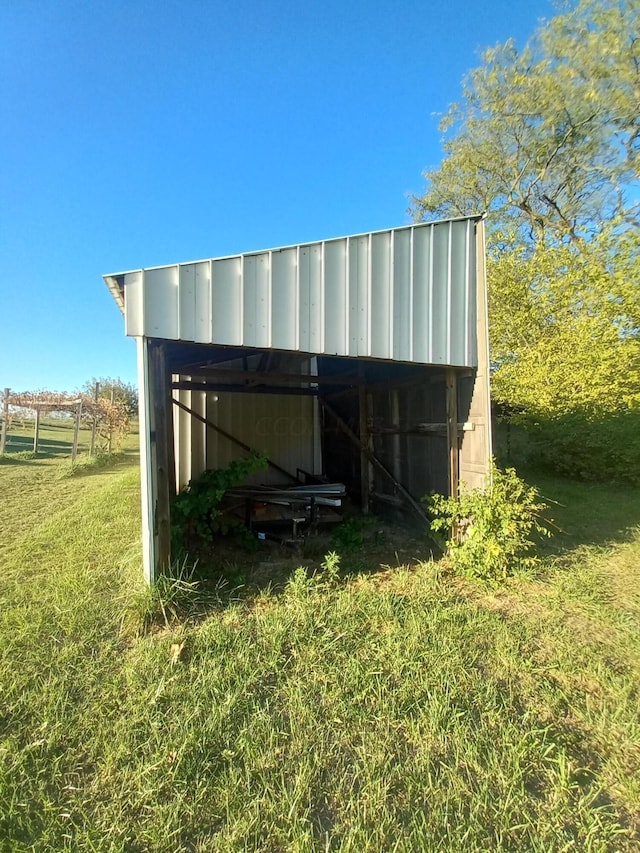 view of outdoor structure with a lawn