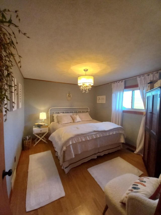 bedroom with wood-type flooring