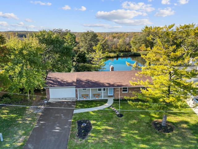 5608 Cardinal Dr, Orient, OH 43146 - single story home with a front lawn, asphalt driveway, a water view, a chimney, and a forest view