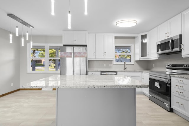 5608 Cardinal Dr, Orient, OH 43146 - kitchen with appliances with stainless steel finishes, plenty of natural light, and white cabinetry
