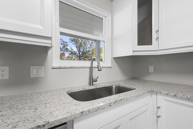 5608 Cardinal Dr, Orient, OH 43146 - kitchen featuring white cabinets, glass insert cabinets, and light stone counters