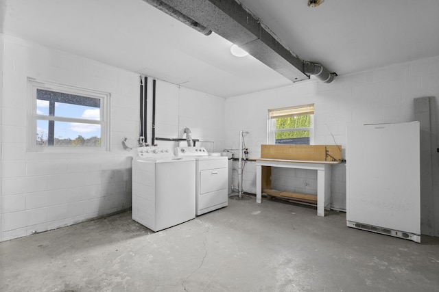 5608 Cardinal Dr, Orient, OH 43146 - below grade area featuring separate washer and dryer, concrete block wall, and freestanding refrigerator