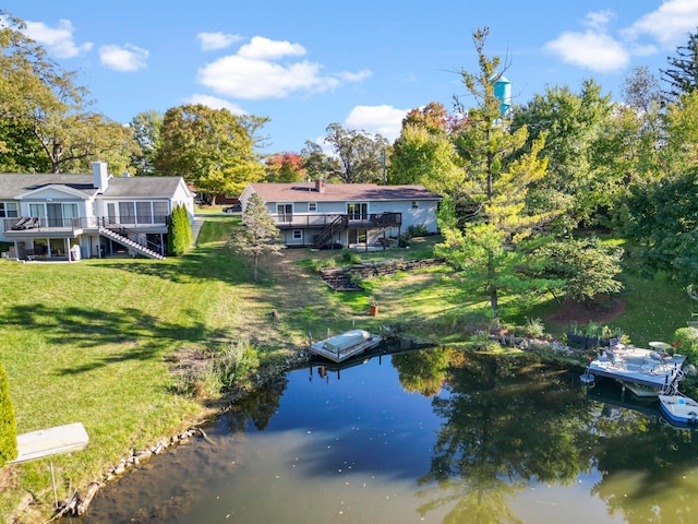 5608 Cardinal Dr, Orient, OH 43146 - rear view of property with stairway, a deck with water view, and a lawn