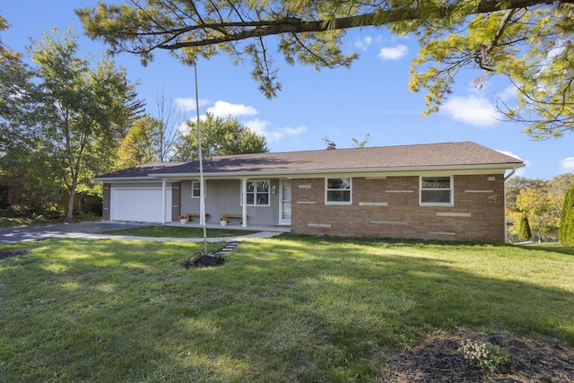 5608 Cardinal Dr, Orient, OH 43146 - single story home featuring brick siding, a front yard, a garage, and driveway