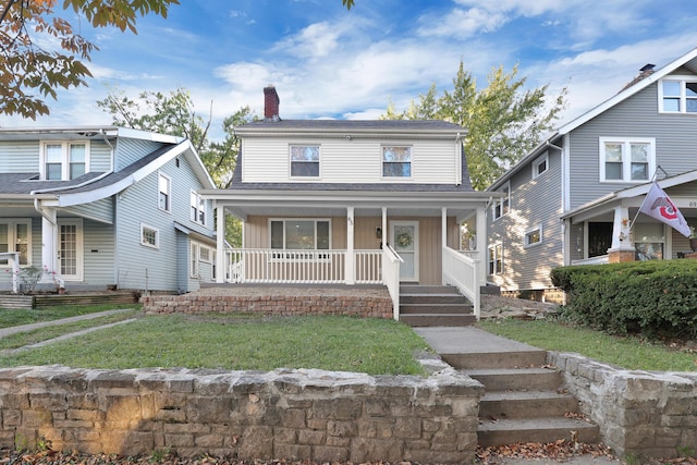 view of front facade featuring a porch and a front lawn