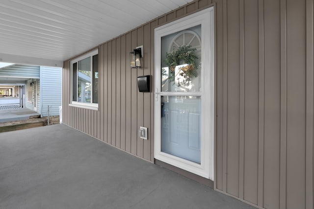 doorway to property featuring covered porch