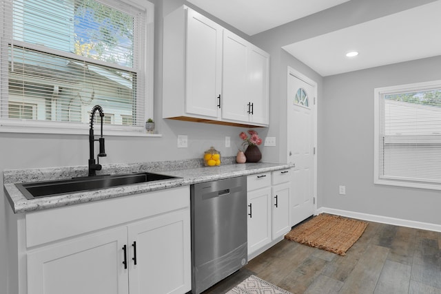 kitchen featuring dishwasher, white cabinets, dark wood-type flooring, and sink