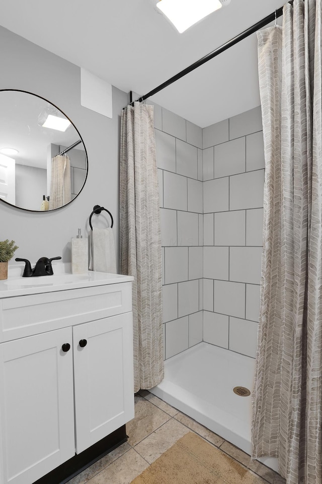 bathroom featuring a shower with shower curtain, vanity, and tile patterned floors