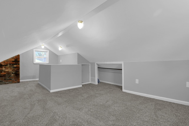 bonus room with carpet and lofted ceiling