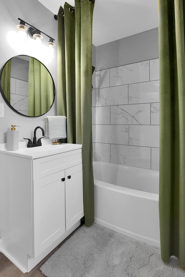 bathroom with vanity and shower / bathtub combination with curtain