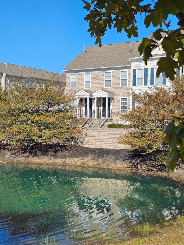 rear view of house with a water view