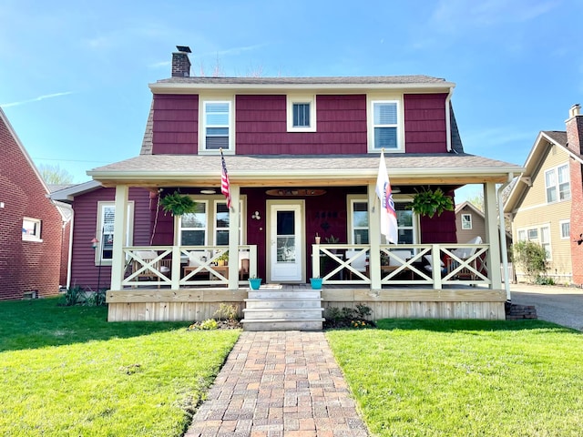 view of front facade with a porch and a front lawn