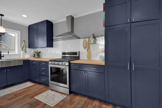 kitchen featuring wall chimney range hood, sink, dark wood-type flooring, and gas range