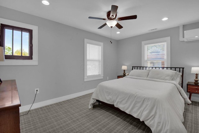 bedroom featuring carpet, multiple windows, an AC wall unit, and ceiling fan