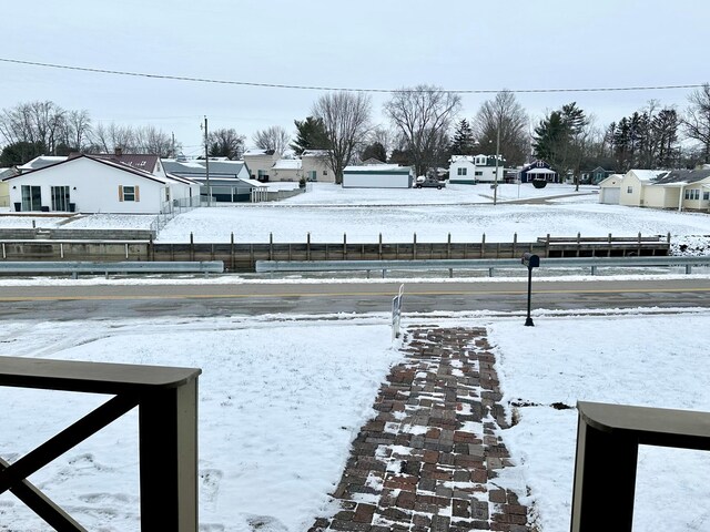 view of yard layered in snow