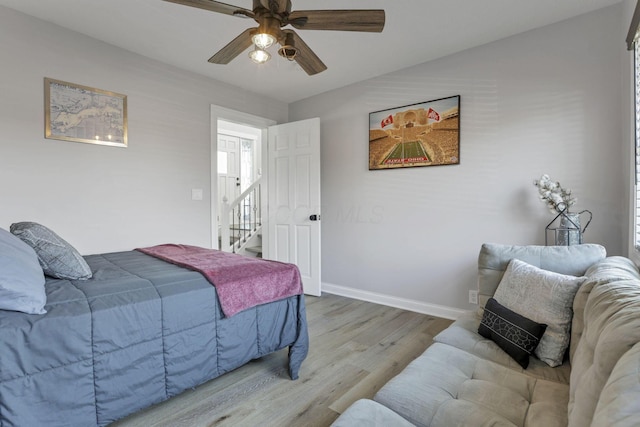 bedroom featuring ceiling fan and wood-type flooring