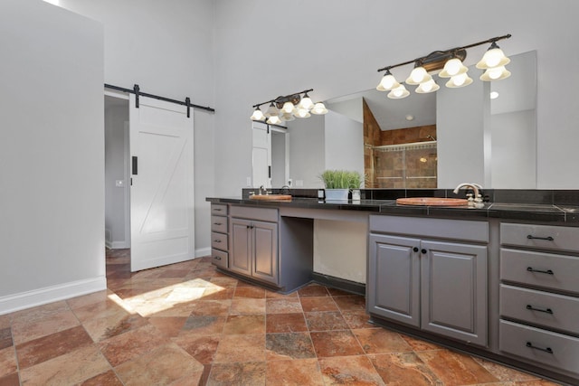 bathroom with vanity and a shower with shower door