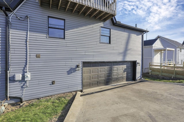 view of side of home with a garage