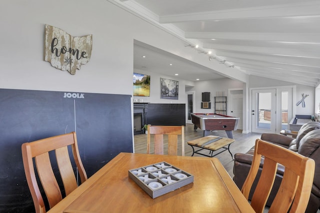 dining area with hardwood / wood-style flooring, vaulted ceiling with beams, pool table, and french doors