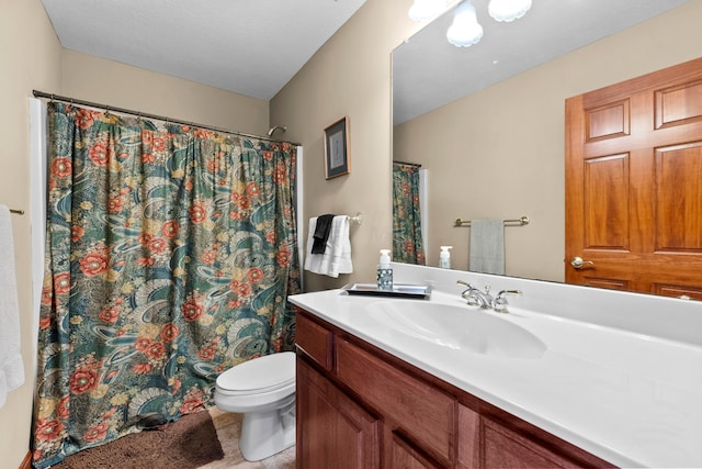 bathroom with tile patterned flooring, vanity, toilet, and curtained shower