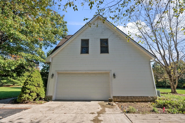 view of side of property featuring a garage