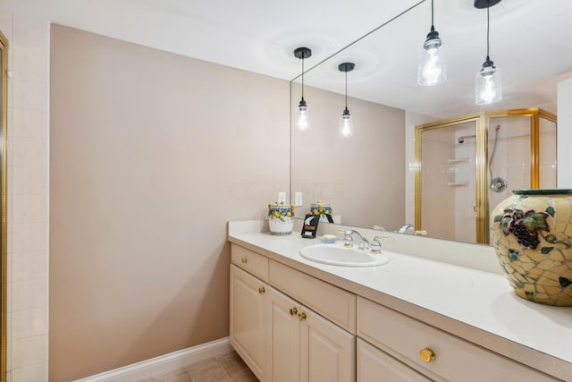 bathroom with an enclosed shower and vanity