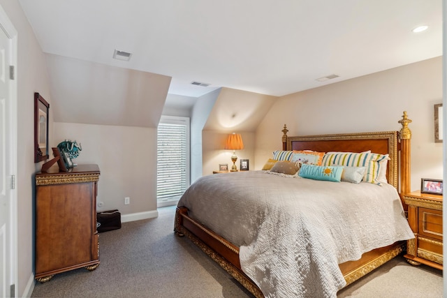 carpeted bedroom featuring lofted ceiling