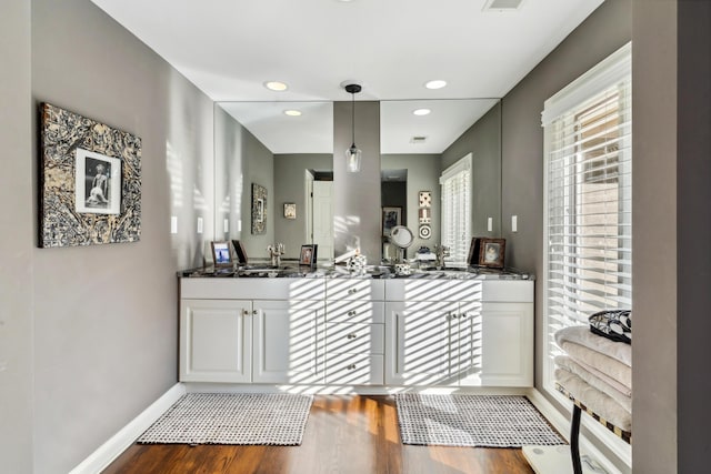 bathroom with vanity and wood-type flooring